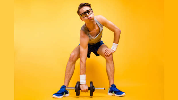 It's too hard for me! Full length, legs, body, size portrait of youth man look at camera can not lift dumbbells from the floor isolated on vivid yellow background