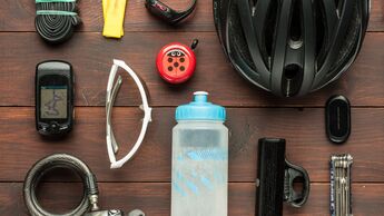 old used cycling accessories on wooden table